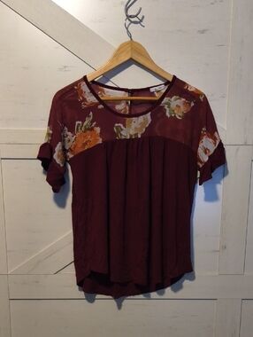 Cute Blouse! Maurices Size M. Sheer on top.